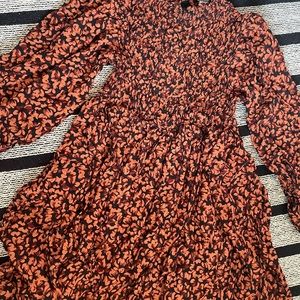 Never worn. Mustard orange with black floral design.